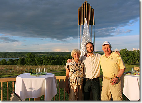 Carol, Lawrence, and Jim Doolittle pose together in front of the stay sail on the winery deck